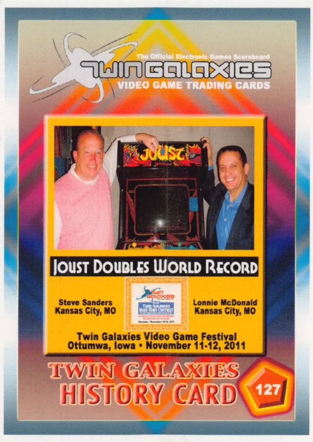 Front of Twin Galaxies history card no. 127: Steve Sanders and Lonnie McDonald on either side of a Joust arcade machine, under the heading Joust Doubles World Record, Twin Galaxies Video Game Festival, Ottumwa, Iowa, November 11-12, 2011