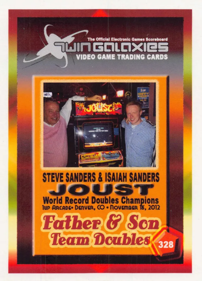 Front of Twin Galaxies trading card no. 328: Steve Sanders and his son Isaiah Sanders on either side of a Joust arcade machine, labeled Joust World Record Doubles Champions, 1up Arcade, Denver, CO, November 18, 2012, Father & Son Team Doubles